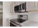 Close up of the stainless steel oven, microwave, and countertops at 19801 N 6Th Pl, Phoenix, AZ 85024