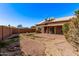 View of the spacious backyard with a covered patio, offering ample outdoor space at 19801 N 6Th Pl, Phoenix, AZ 85024