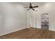 Bedroom with wood flooring and bright open closet at 19801 N 6Th Pl, Phoenix, AZ 85024