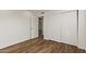 This bedroom has wood flooring and a large closet at 19801 N 6Th Pl, Phoenix, AZ 85024