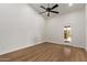 Bedroom with wood flooring and bright sliding door to the outside at 19801 N 6Th Pl, Phoenix, AZ 85024