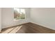 This bedroom has wood flooring and a view at 19801 N 6Th Pl, Phoenix, AZ 85024
