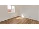 This bedroom has wood flooring and a window at 19801 N 6Th Pl, Phoenix, AZ 85024