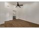 Bedroom with wood flooring and access to the bathroom at 19801 N 6Th Pl, Phoenix, AZ 85024