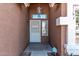 Inviting front entry with security screen door, decorative light fixture and desert accents at 19801 N 6Th Pl, Phoenix, AZ 85024