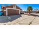 Charming single-Gathering home featuring a two-car garage, desert landscaping and a lush palm tree at 19801 N 6Th Pl, Phoenix, AZ 85024