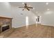 Bright living room with tile flooring, fireplace, and ceiling fan at 19801 N 6Th Pl, Phoenix, AZ 85024