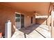 Covered patio with ceiling fan and lighting, providing a relaxing outdoor space at 19801 N 6Th Pl, Phoenix, AZ 85024