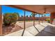 Covered patio with brick and concrete flooring, looking out to the fenced yard at 19801 N 6Th Pl, Phoenix, AZ 85024