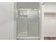 Bathroom shower with marble tile and sliding glass door at 19801 N 6Th Pl, Phoenix, AZ 85024