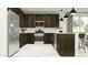 Open kitchen with stainless steel appliances, dark wood cabinets, and white countertops, offering a stylish and functional space at 20897 S 231St Pl, Queen Creek, AZ 85142
