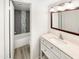Bright bathroom featuring a modern vanity, stylish mirror, and tiled shower at 2121 S Pennington -- # 58, Mesa, AZ 85202