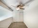 Lofted bedroom featuring neutral carpet, closet and ceiling fan at 2121 S Pennington -- # 58, Mesa, AZ 85202