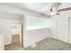 Lofted bedroom featuring neutral carpet, closet and ceiling fan with pass-through to another room at 2121 S Pennington -- # 58, Mesa, AZ 85202