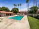 Community pool and spa area featuring lush landscaping and mature palm trees at 2121 S Pennington -- # 58, Mesa, AZ 85202