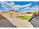 A low maintenance backyard with small grass area and gravel at 21366 E Alyssa Rd, Queen Creek, AZ 85142
