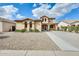 Charming two-story home features desert landscaping and a long, paved driveway at 21366 E Alyssa Rd, Queen Creek, AZ 85142