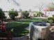 Beautifully landscaped backyard featuring a putting green and mature landscaping at 21947 E Via Del Palo --, Queen Creek, AZ 85142