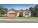 Charming single-story home featuring a two-car garage, manicured lawn, and inviting curb appeal at 23139 E Lords Way, Queen Creek, AZ 85142
