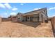 Expansive backyard with a covered patio and potential for landscaping at 23146 E Canary Way, Queen Creek, AZ 85142