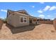 Wide backyard showcasing the exterior of the home with a covered patio at 23146 E Canary Way, Queen Creek, AZ 85142