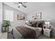 Comfortable bedroom featuring a ceiling fan, neutral paint, and stylish decor at 23146 E Canary Way, Queen Creek, AZ 85142