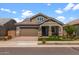 Beautiful single-Gathering home with well-maintained landscaping and a two-car garage at 23146 E Canary Way, Queen Creek, AZ 85142