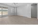 Spacious living room with recessed lighting, ceiling fan, and sliding glass door at 23146 E Canary Way, Queen Creek, AZ 85142