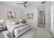 Cozy bedroom with carpet, ceiling fan, art, and large bed at 23146 E Canary Way, Queen Creek, AZ 85142