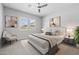 Cozy bedroom with carpet, ceiling fan, art, and large bed at 23146 E Canary Way, Queen Creek, AZ 85142