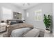 Beautifully staged main bedroom featuring neutral colors, plantation shutters, and modern decor at 23146 E Canary Way, Queen Creek, AZ 85142