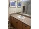 Well-lit bathroom with a vanity, large mirror, and a shower/tub combination at 2605 W Rose Lane -- # B201, Phoenix, AZ 85017