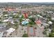 Aerial view of the home and surrounding neighborhood featuring a community clubhouse and tennis court at 2818 E Malapai Dr, Phoenix, AZ 85028