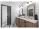 Elegant bathroom with double vanity, marble countertops, and modern fixtures at 2818 E Malapai Dr, Phoenix, AZ 85028