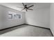 Bedroom featuring neutral paint, a ceiling fan, neutral carpeting, and natural light at 2818 E Malapai Dr, Phoenix, AZ 85028