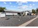 Southwest-style home with a desert xeriscape front yard and a gray roof at 2818 E Malapai Dr, Phoenix, AZ 85028