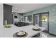 Modern kitchen featuring gray cabinets, a white quartz countertop, and a view of the outdoor patio at 2818 E Malapai Dr, Phoenix, AZ 85028