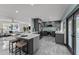 Stylish kitchen with an island, stainless steel appliances, gray cabinets, and open to the living area at 2818 E Malapai Dr, Phoenix, AZ 85028