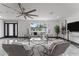 A modern living room featuring neutral tones, sleek decor, and a view of the front yard at 2818 E Malapai Dr, Phoenix, AZ 85028