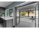 Bright kitchen showcasing an outdoor view with a covered patio and landscaped backyard at 2818 E Malapai Dr, Phoenix, AZ 85028