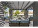 Stylish outdoor seating area with comfortable furniture, a fire pit, and a shaded pergola at 2818 E Malapai Dr, Phoenix, AZ 85028
