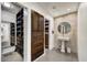 Spacious walk-in closet located just off the bathroom, features dark wood at 31 E Bishop Dr, Tempe, AZ 85282