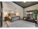 Comfortable bedroom with neutral tones, accent lighting, and view to the outside at 31 E Bishop Dr, Tempe, AZ 85282
