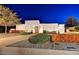 Contemporary-style home with well-maintained landscaping, lighting and modern fence detail at 31 E Bishop Dr, Tempe, AZ 85282