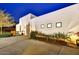 Modern desert home featuring minimalist landscaping and a concrete driveway at twilight at 31 E Bishop Dr, Tempe, AZ 85282