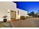 Well-lit modern home showcasing desert landscaping and an ornate security gate at 31 E Bishop Dr, Tempe, AZ 85282