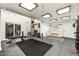 Large home gym featuring a variety of equipment and ample space for exercise at 31 E Bishop Dr, Tempe, AZ 85282