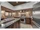 Modern kitchen featuring brick backsplash, stainless steel appliances, and large island at 31 E Bishop Dr, Tempe, AZ 85282
