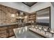 Well-appointed kitchen with brick backsplash, stainless steel appliances, and center island at 31 E Bishop Dr, Tempe, AZ 85282