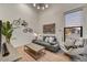 Bright, stylish living room with high ceilings, modern furnishings, and a large window at 31 E Bishop Dr, Tempe, AZ 85282